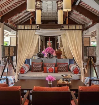 Thai-style lobby lounge with canopy daybed at Anantara Hua Hin Resort