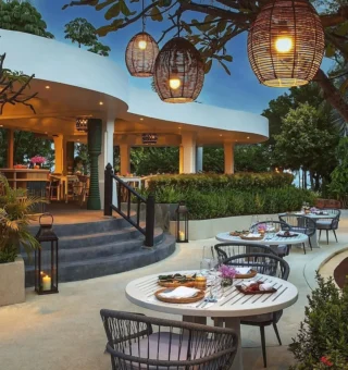 Garden restaurant terrace lit with lanterns at Anantara Hua Hin Resort