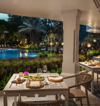 Poolside dining pavilion in the evening at Anantara Hua Hin Resort