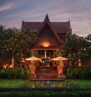 Thai pavilion lit at dusk at Anantara Hua Hin Resort
