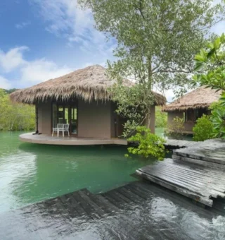 Thatched lagoon villas among mangroves at The Blue Sky Resort Koh Payam