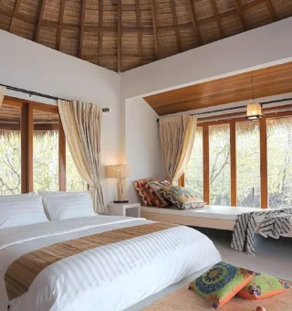 Villa bedroom with bay windows at The Blue Sky Resort Koh Payam