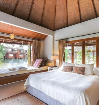 Bright bedroom with lagoon view at The Blue Sky Resort Koh Payam