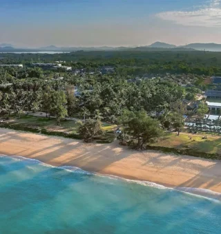 Aerial view of Mai Khao Beach and the resort at JW Marriott Phuket Resort & Spa