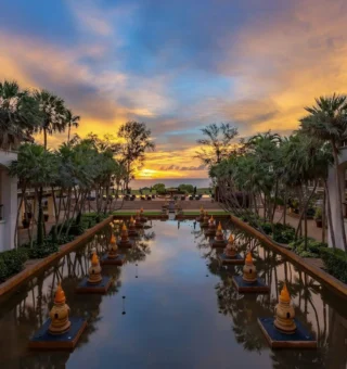 Reflection pond and palms at sunset at JW Marriott Phuket Resort & Spa