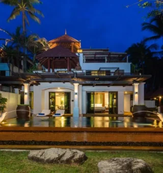 Thai-style villa lit at night at JW Marriott Phuket Resort & Spa