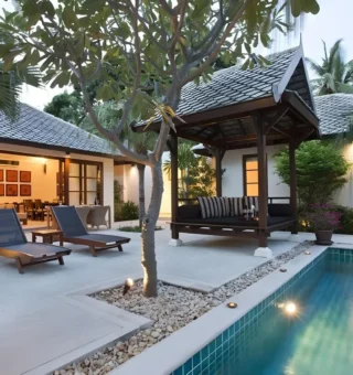 Villa pool terrace at dusk at The Villas by Kanda Residences