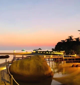 Boardwalk and boulders lit up at sunset at Nangyuan Island Dive Resort