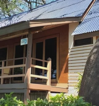 Wooden chalet tucked among granite boulders at Nangyuan Island Dive Resort