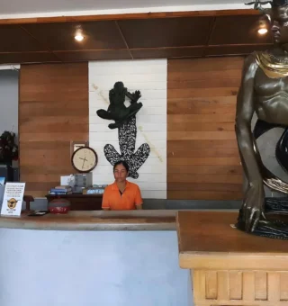Reception lobby with carved statue at Nangyuan Island Dive Resort