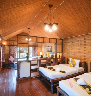 Wood-paneled twin room with pendant lights at Nangyuan Island Dive Resort