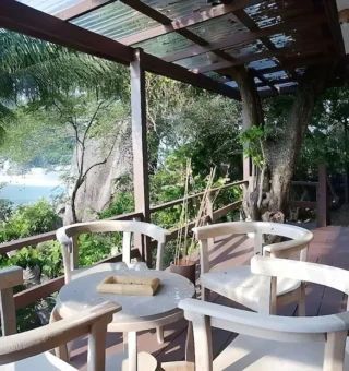 Shaded terrace with chairs above the sea at Nangyuan Island Dive Resort