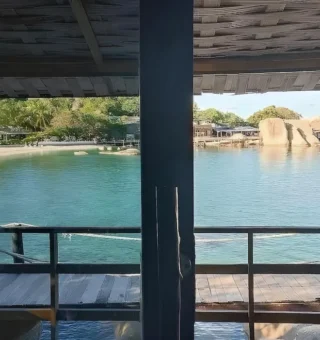 Bay view from a covered wooden deck at Nangyuan Island Dive Resort