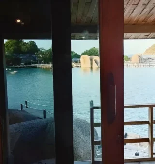 Sea view framed by a timber balcony at Nangyuan Island Dive Resort