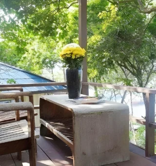 Garden balcony with seating among the trees at Nangyuan Island Dive Resort
