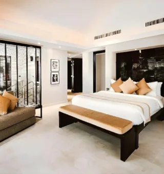 Two Bedroom Pool View Family Suite - Bed at Nikki Beach Resort & Spa