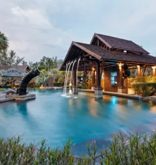 Pool with fountain and Thai-style pavilion at The Slate Phuket