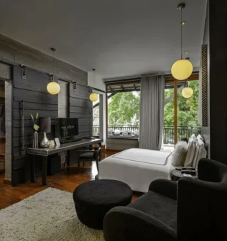 Suite with sitting area and garden view at The Slate Phuket