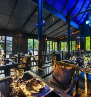 Restaurant terrace with garden views at The Slate Phuket
