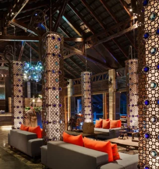 Open-air lounge with jeweled columns at The Slate Phuket
